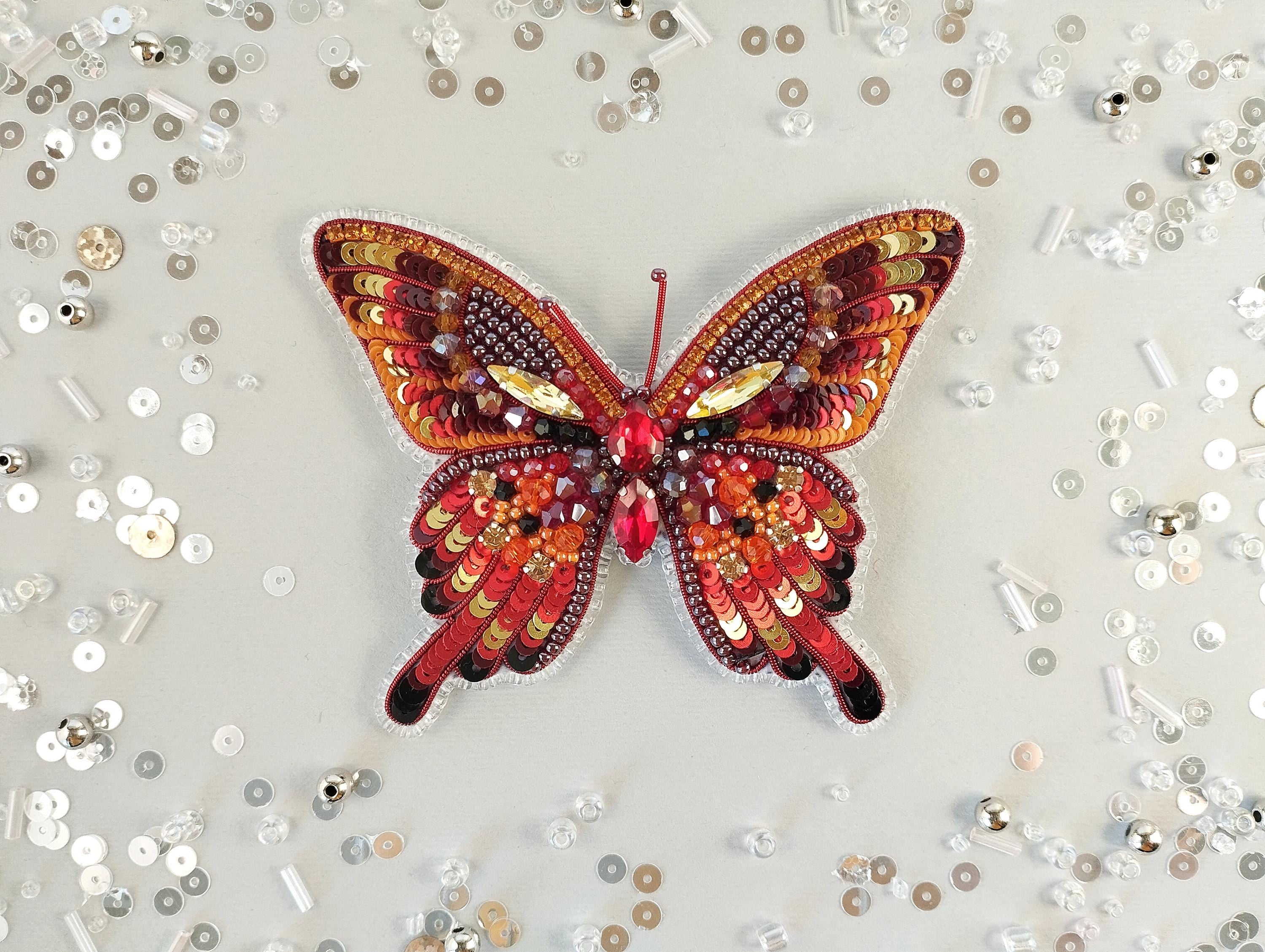 a butterfly made out of buttons on a table